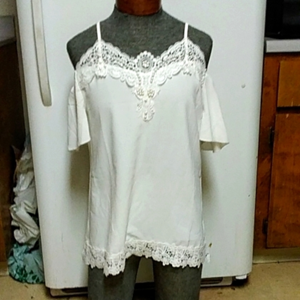 Gorgeous white embroidery top with ebellishments.